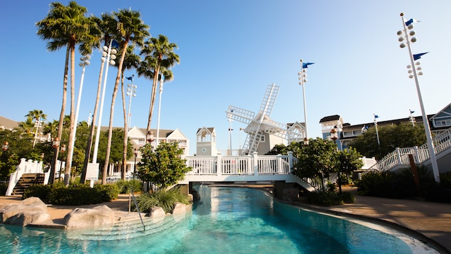 Palm trees, walkway and windmill over Stormalong Bay at Disney's Beach Club Resort