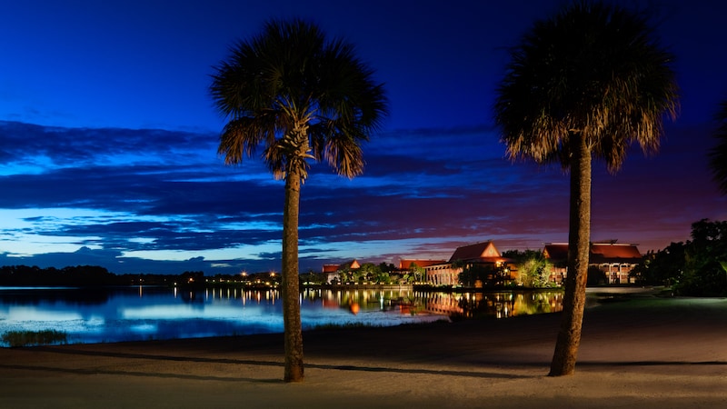 Room Rates At Disney S Polynesian Village Resort Walt World Nighttime View Of Disney S Polynesian Resort Seen From A Nearby Beach
