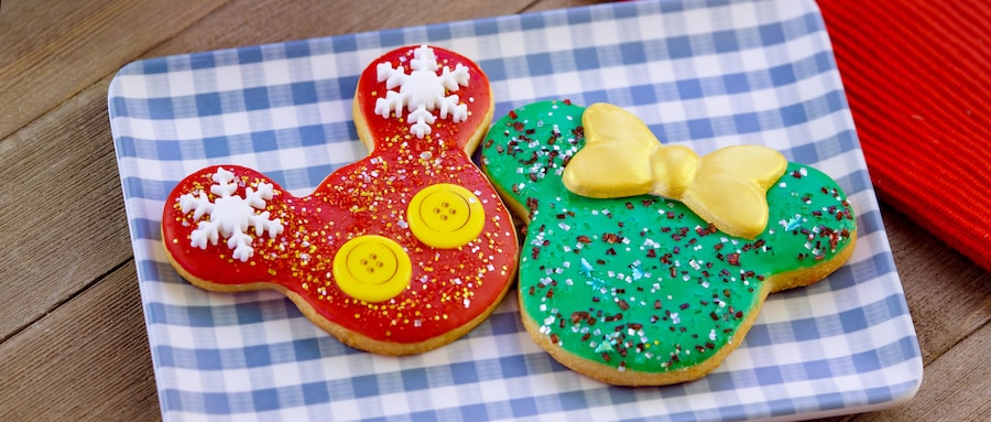 2 cookies decorated to look like Mickey Mouse and Minnie Mouse